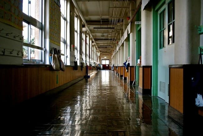 An elementary school with wooden architecture and fixtures requires careful wood finishing, restoration, and maintenance