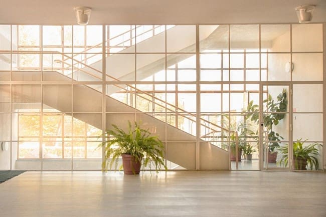 Healthcare property's lobby with large windows and metalwork